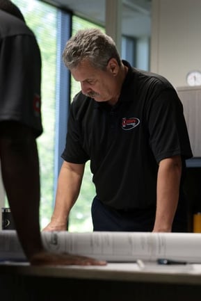Century Fire employee reviewing plans